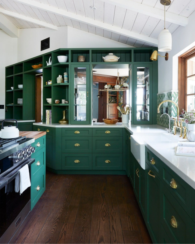 A picture of a green kitchen island design. 